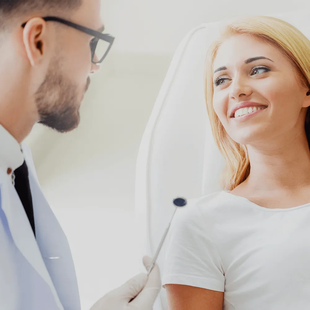 Dentist talking to patient