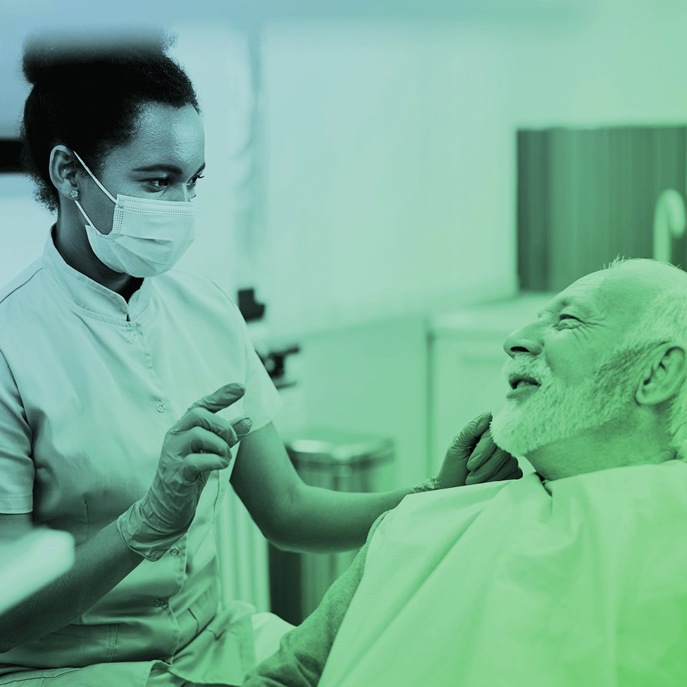 Dentist talking to patient