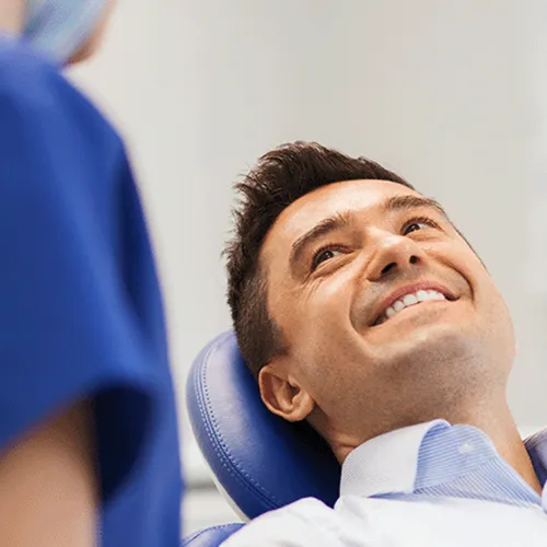 patient-smiling-up-at-dentist