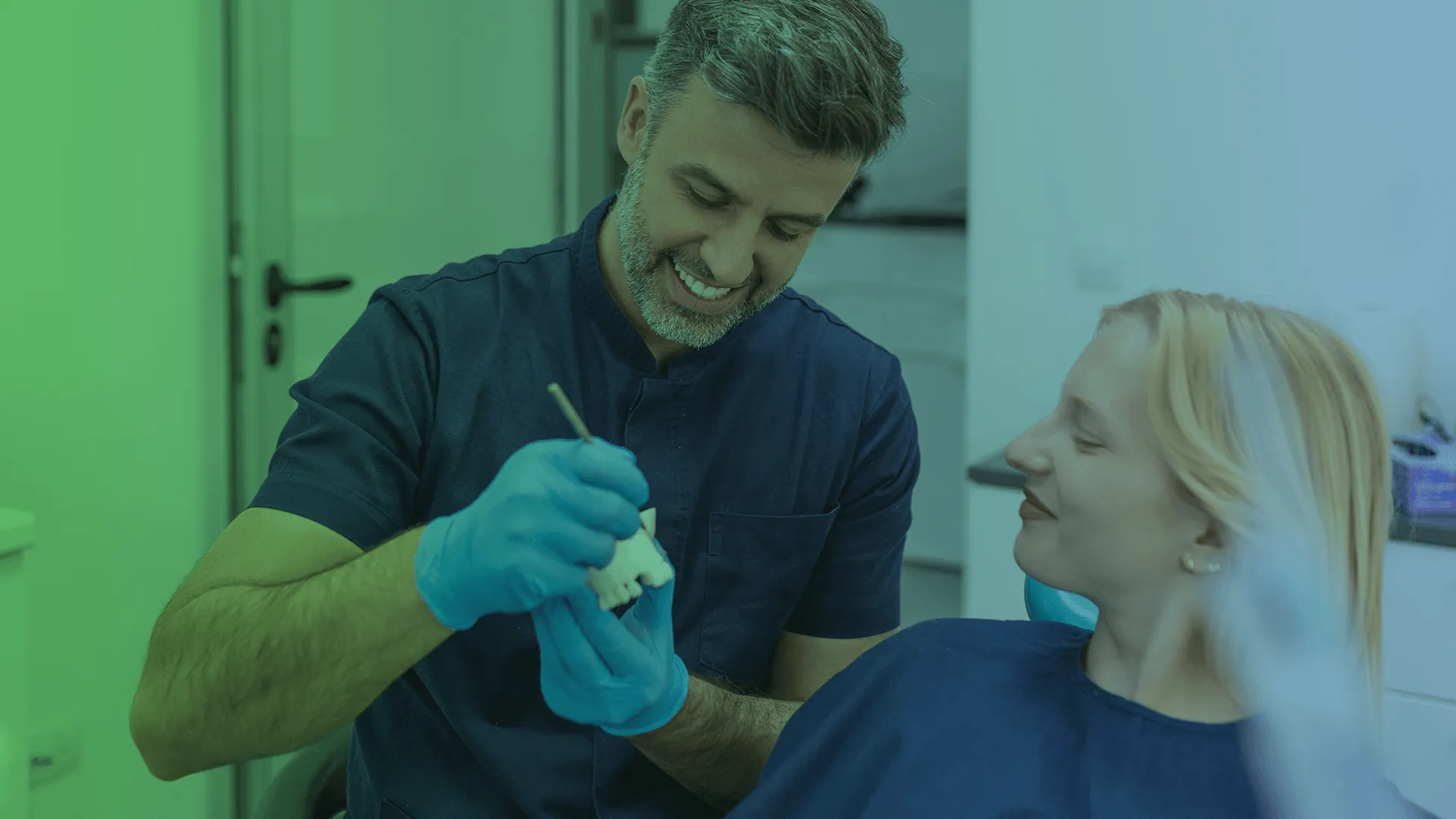 Dentist showing how crowns work