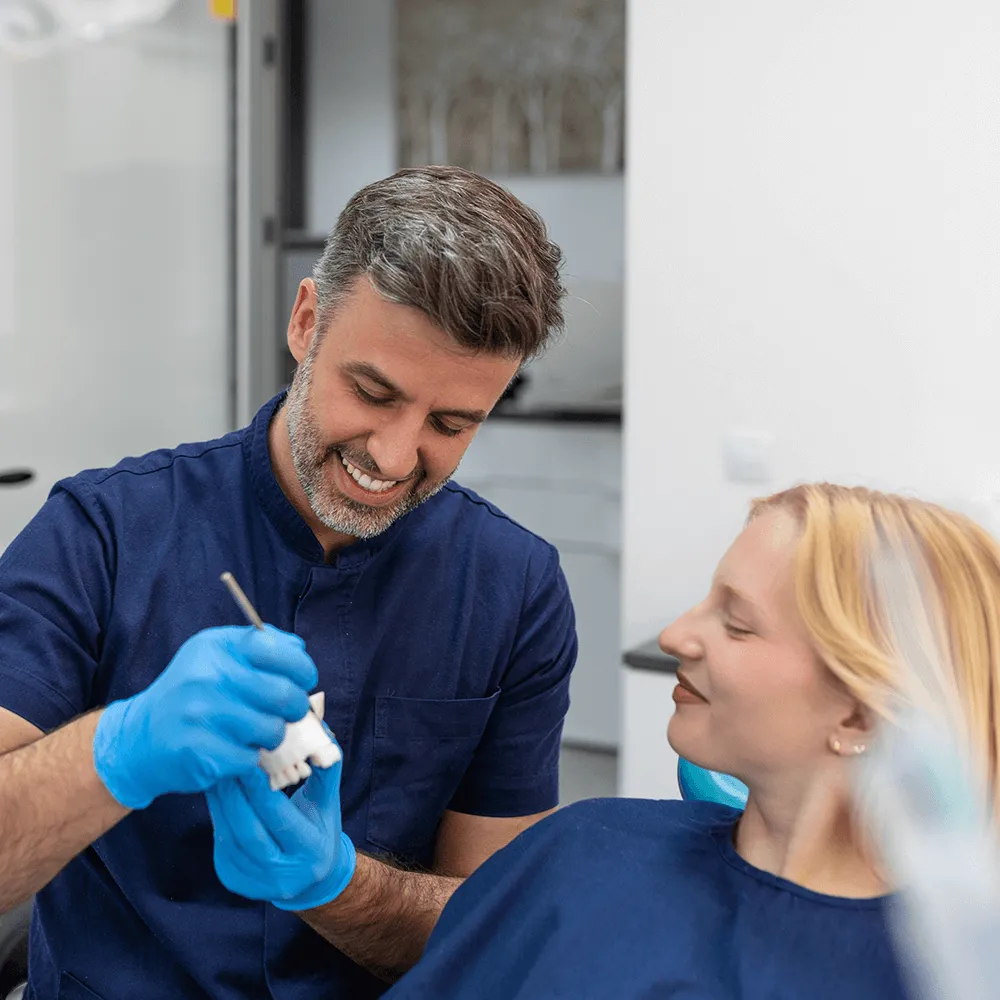 Dentist showing how crowns work